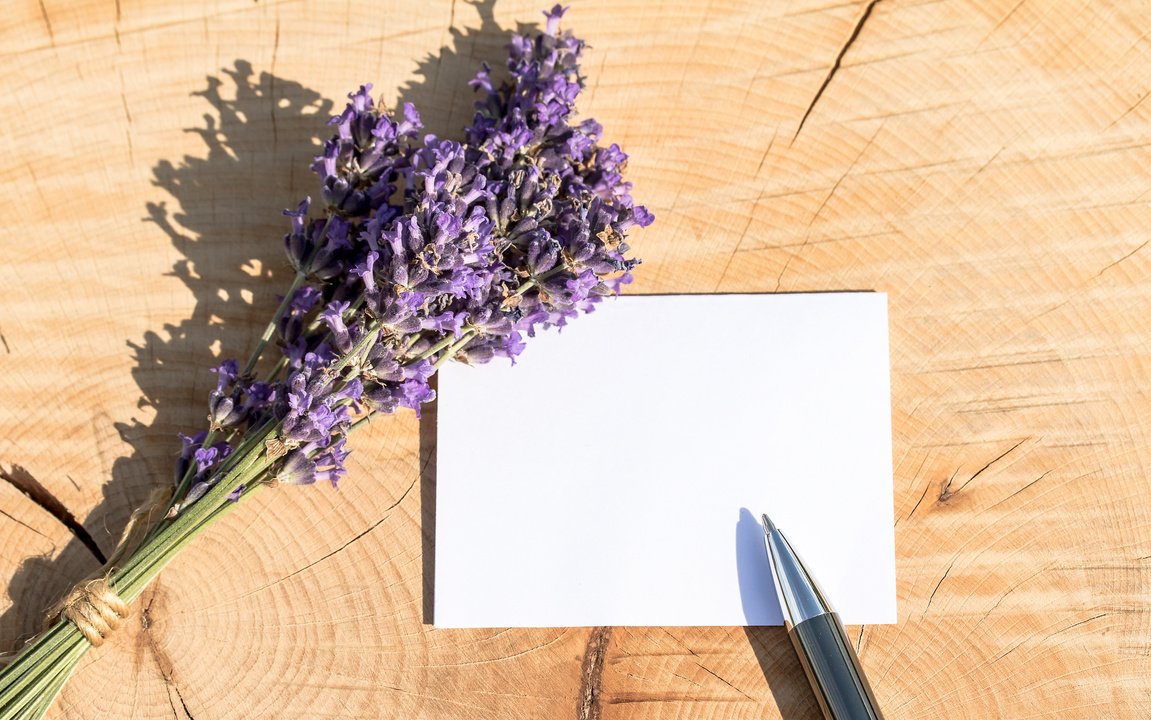 Lavender Flower and a Note on a Wooden Surface
